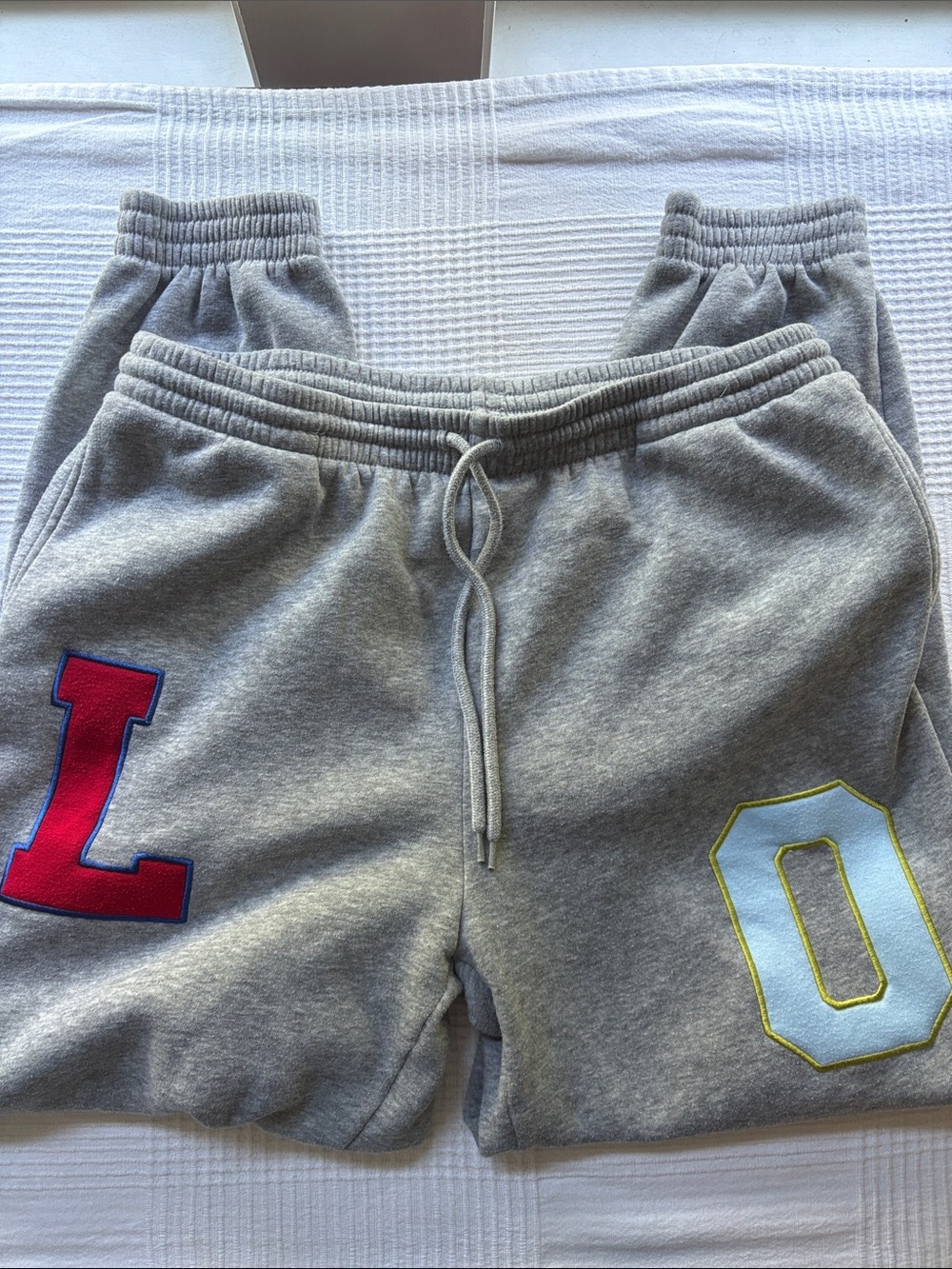 No Boundaries Gray Shorts with Red and Light Blue Letter Patches